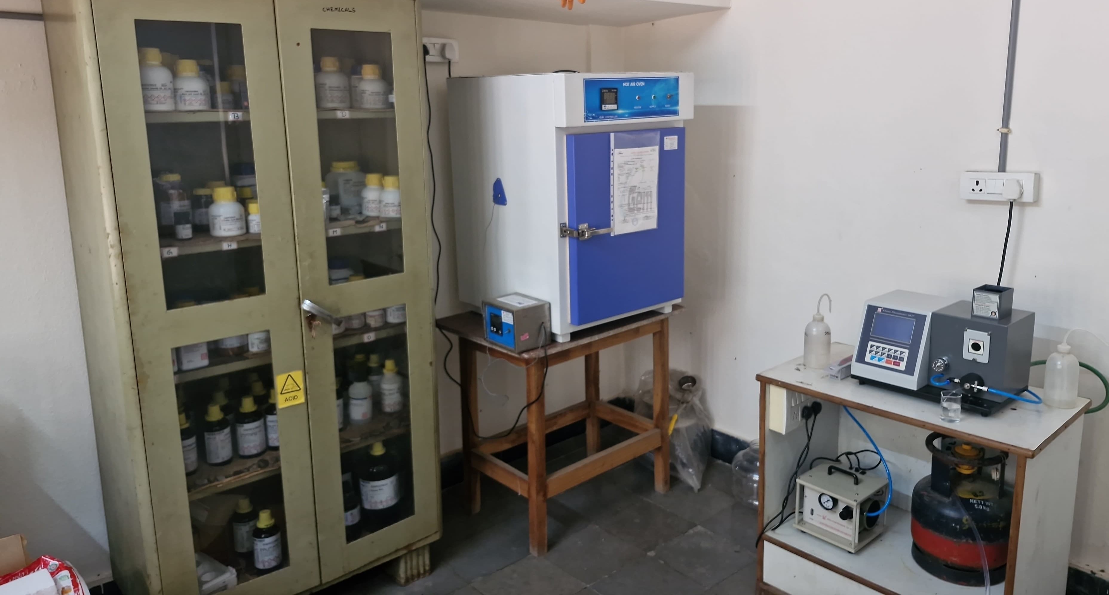 Poto showing flame photometry station and hot air oven in hot-zone